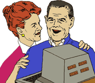 Happy elderly couple in front of computer